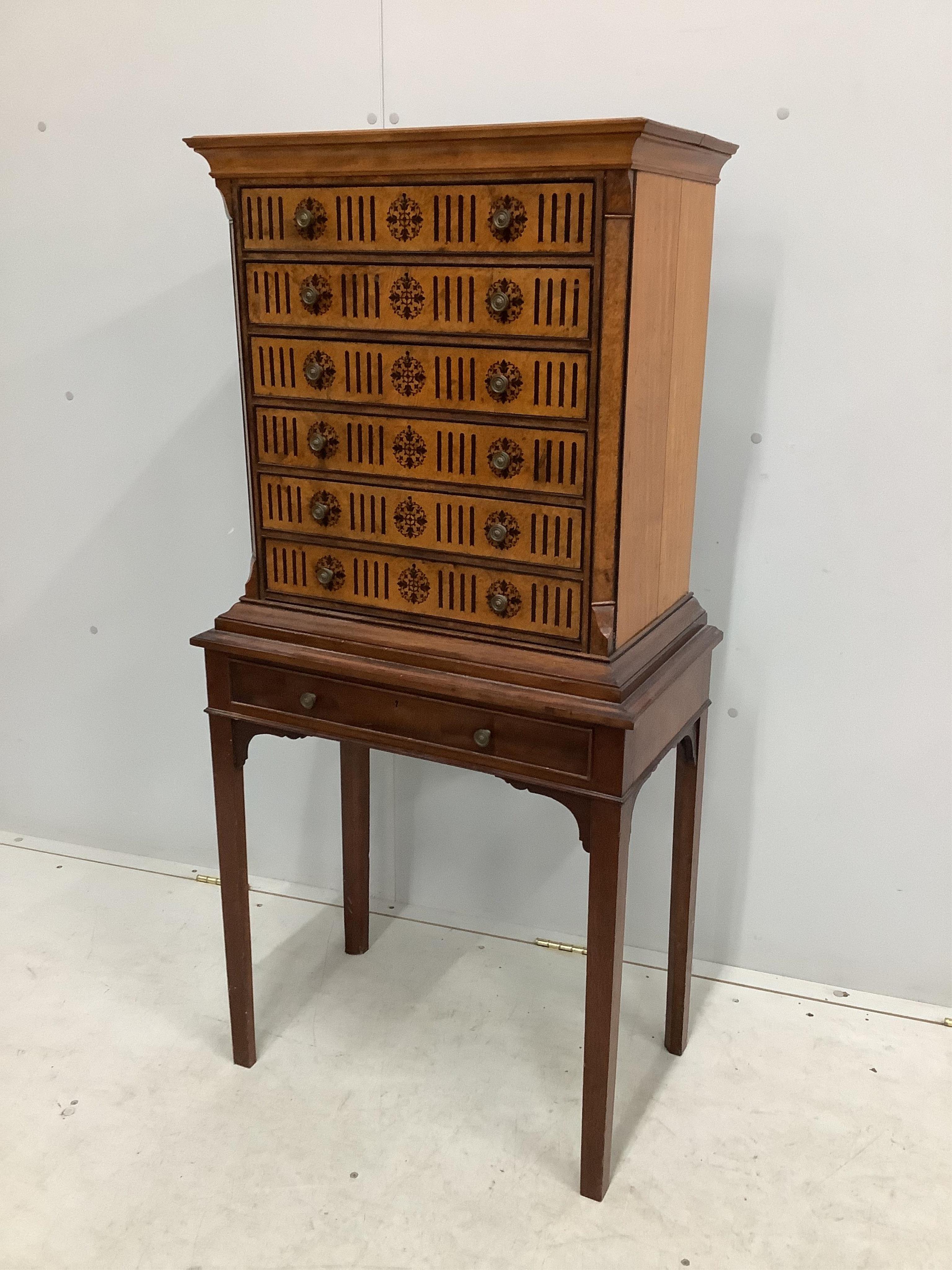 A late Victorian ebony inlaid bird's eye maple and mahogany collector’s chest on later stand, width 62cm, depth 36cm, height 128cm. Condition - fair to good